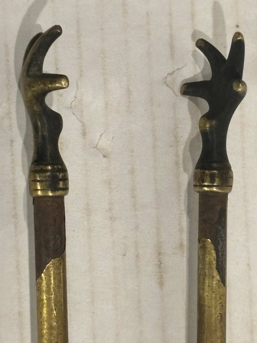 TWO RELATED GEORGIAN BRASS & IRON EMBER OR PIPE TONGS WITH HAND-FORM TERMINALS