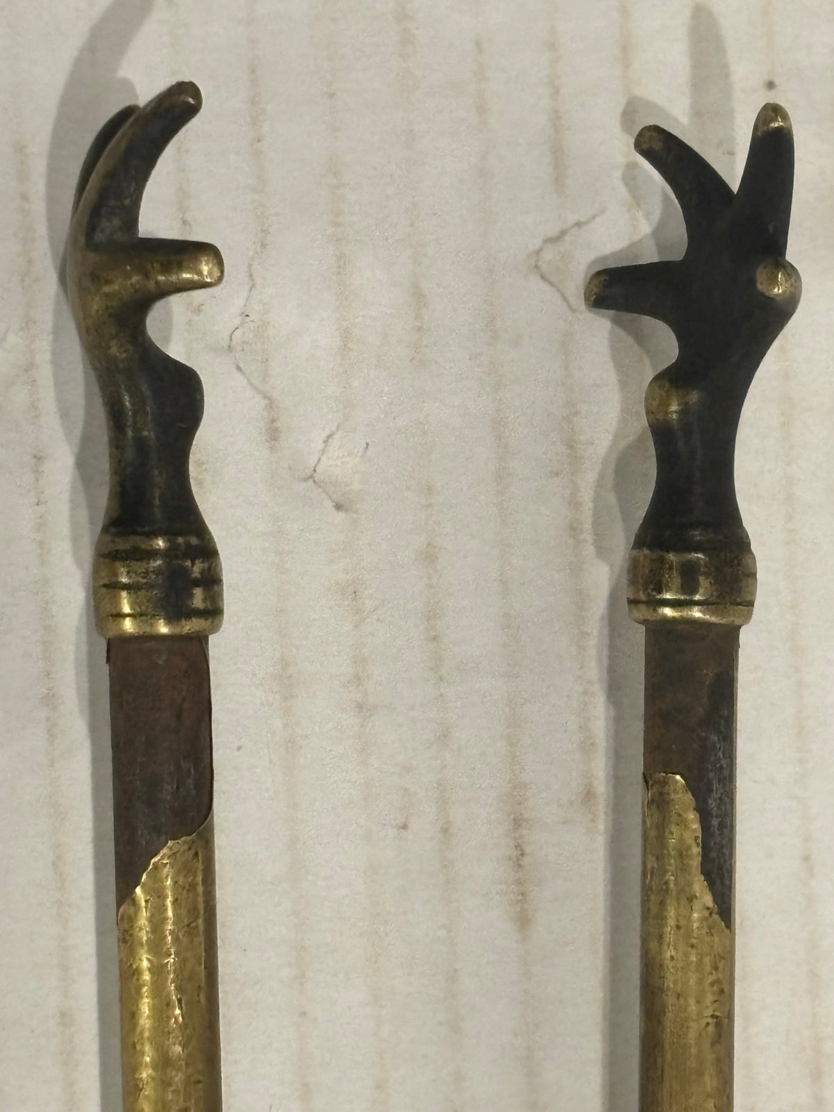 TWO RELATED GEORGIAN BRASS & IRON EMBER OR PIPE TONGS WITH HAND-FORM TERMINALS