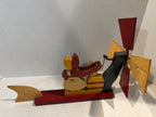 American Carved and Painted Folk Art Whirligig of a Woman Churning Butter, circa 1960–1970.