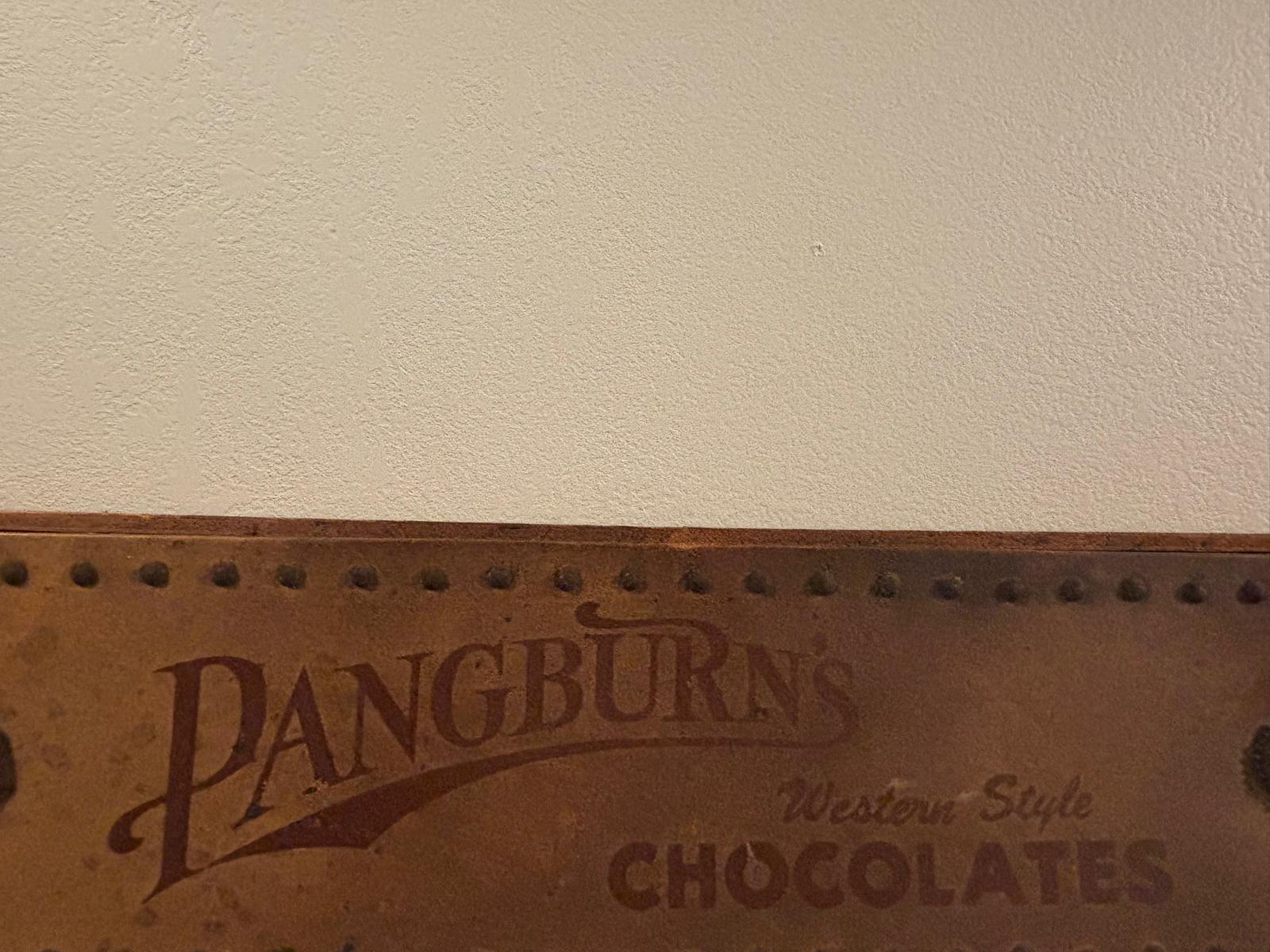Rare Pangburn’s Chocolates double-sided leather trade sign, Fort Worth, Texas, circa 1915–1925.