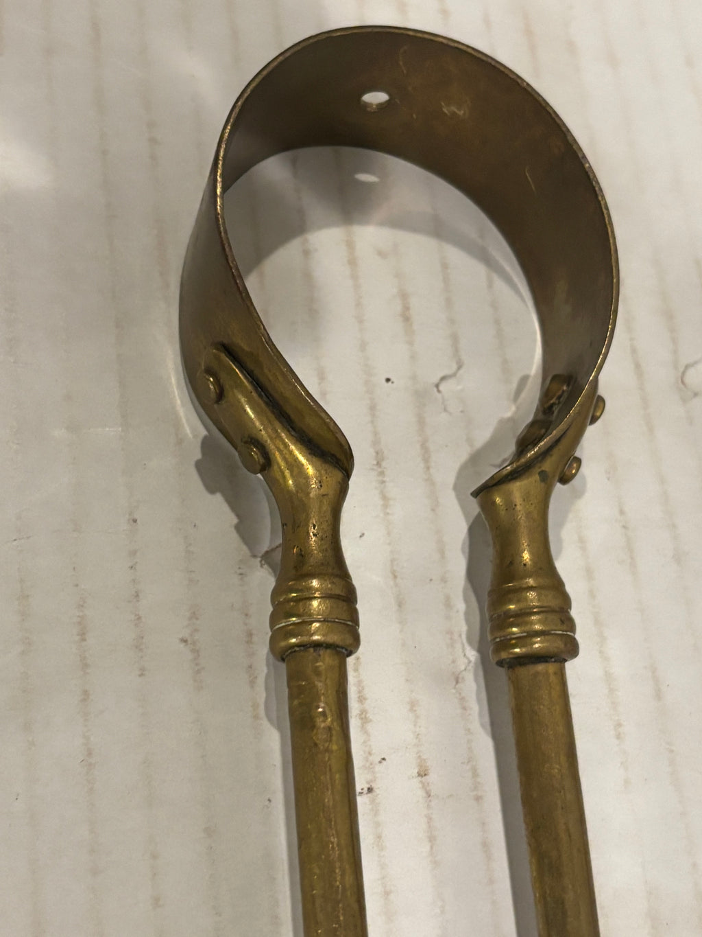 TWO RELATED GEORGIAN BRASS & IRON EMBER OR PIPE TONGS WITH HAND-FORM TERMINALS
