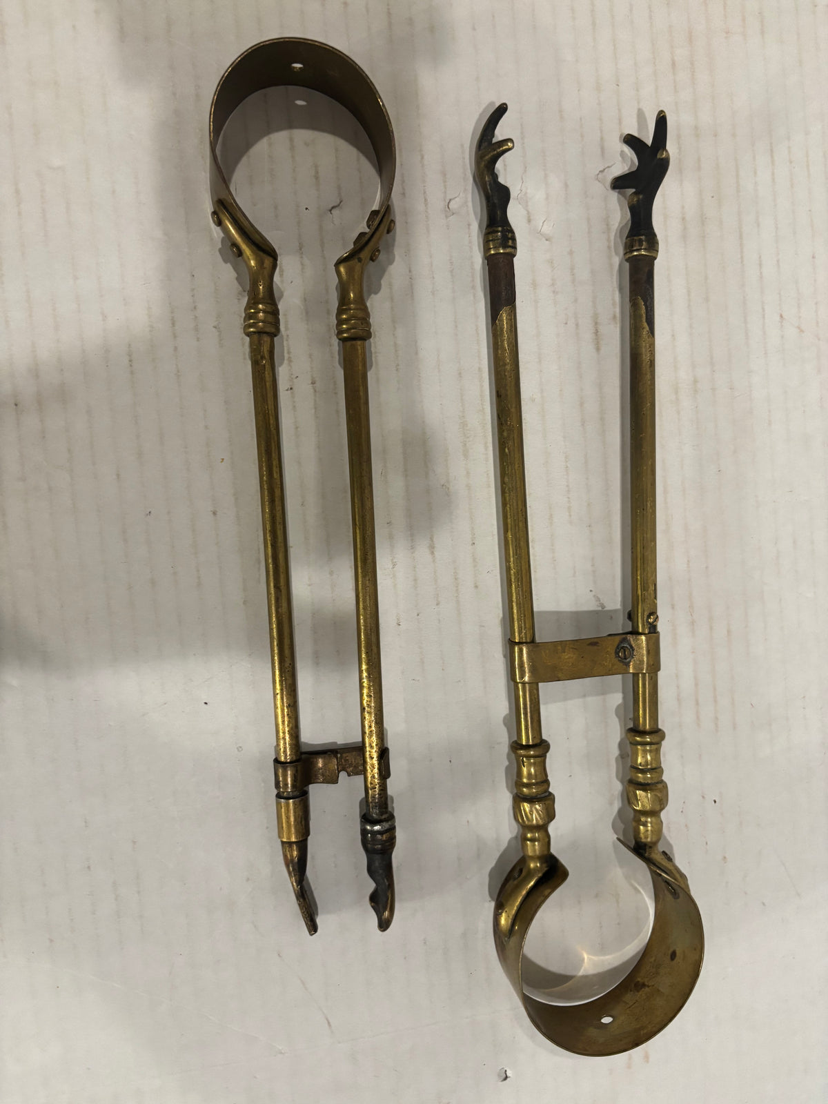 TWO RELATED GEORGIAN BRASS & IRON EMBER OR PIPE TONGS WITH HAND-FORM TERMINALS
