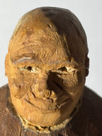 WONDERFULLY EXPRESSIVE CARVED & PAINTED FOLK PORTRAIT OF A SEATED GENTLEMAN