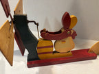 American Carved and Painted Folk Art Whirligig of a Woman Churning Butter, circa 1960–1970.