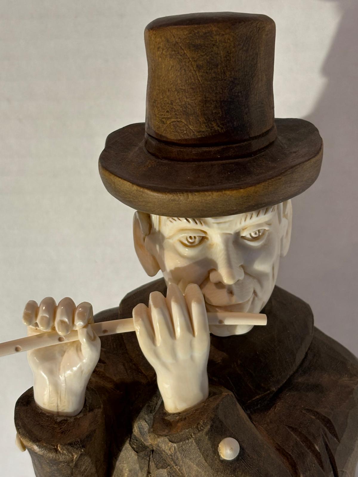 Carved Wood and Bovine Bone Figural Sculpture of a Flute-Playing Gentleman