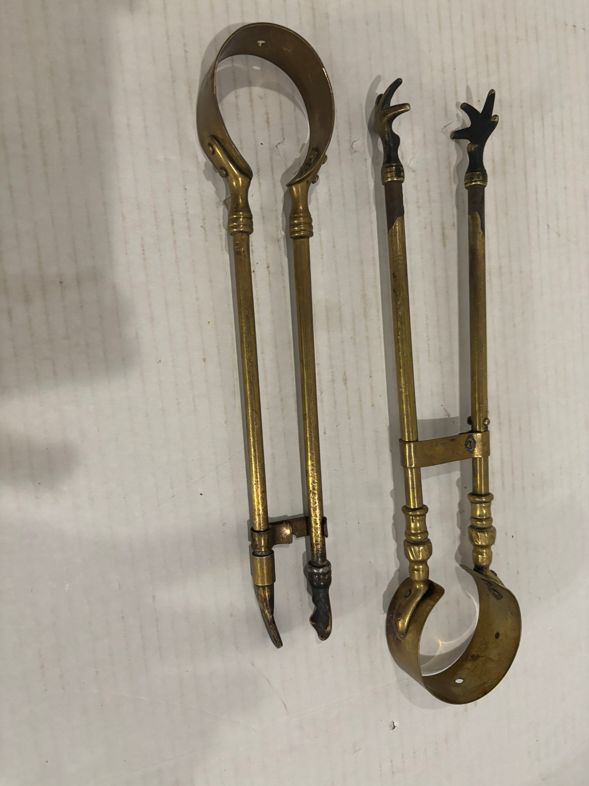 TWO RELATED GEORGIAN BRASS & IRON EMBER OR PIPE TONGS WITH HAND-FORM TERMINALS