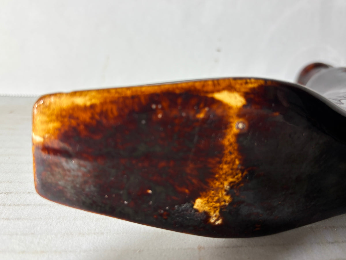 Rare American Rockingham-Glazed Shoe Form Spirit Flask (Bennington Type) American, circa 1845–1860