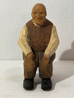 WONDERFULLY EXPRESSIVE CARVED & PAINTED FOLK PORTRAIT OF A SEATED GENTLEMAN