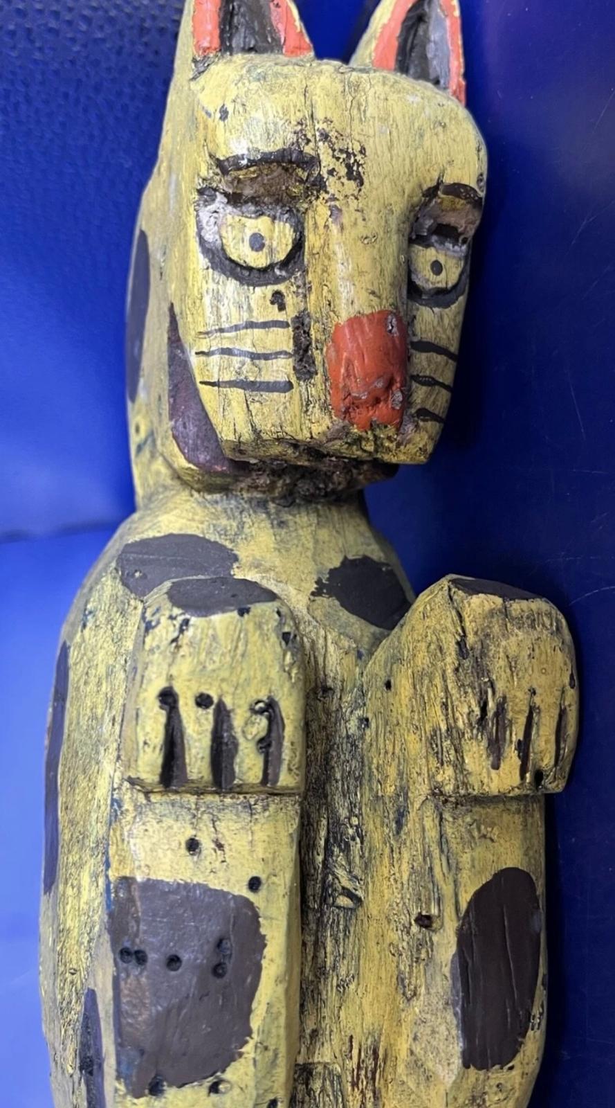 Carved and Painted Yellow Cat Pole Figure