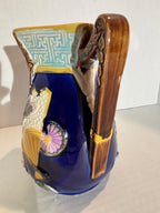 ENGLISH MAJOLICA PITCHER IN THE JAPONESQUE TASTE — ATTRIBUTED TO COPELAND & SONS (MINTON TRADITION), CIRCA 1875–1890