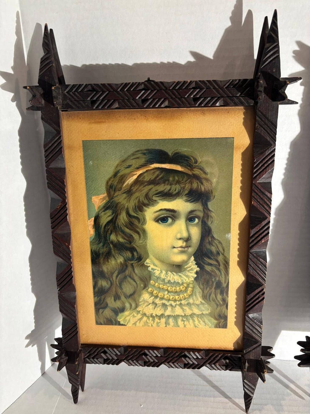 Exceptional Pair of Late 19th Century Chip-Carved Cross-Corner (Oxford) Tramp Art Frames with Original Chromolithographs
