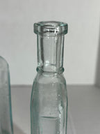 Group of Six Burnett’s Standard Flavoring Extract Bottles, Boston, Late 19th Century