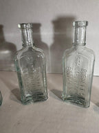 Group of Six Burnett’s Standard Flavoring Extract Bottles, Boston, Late 19th Century