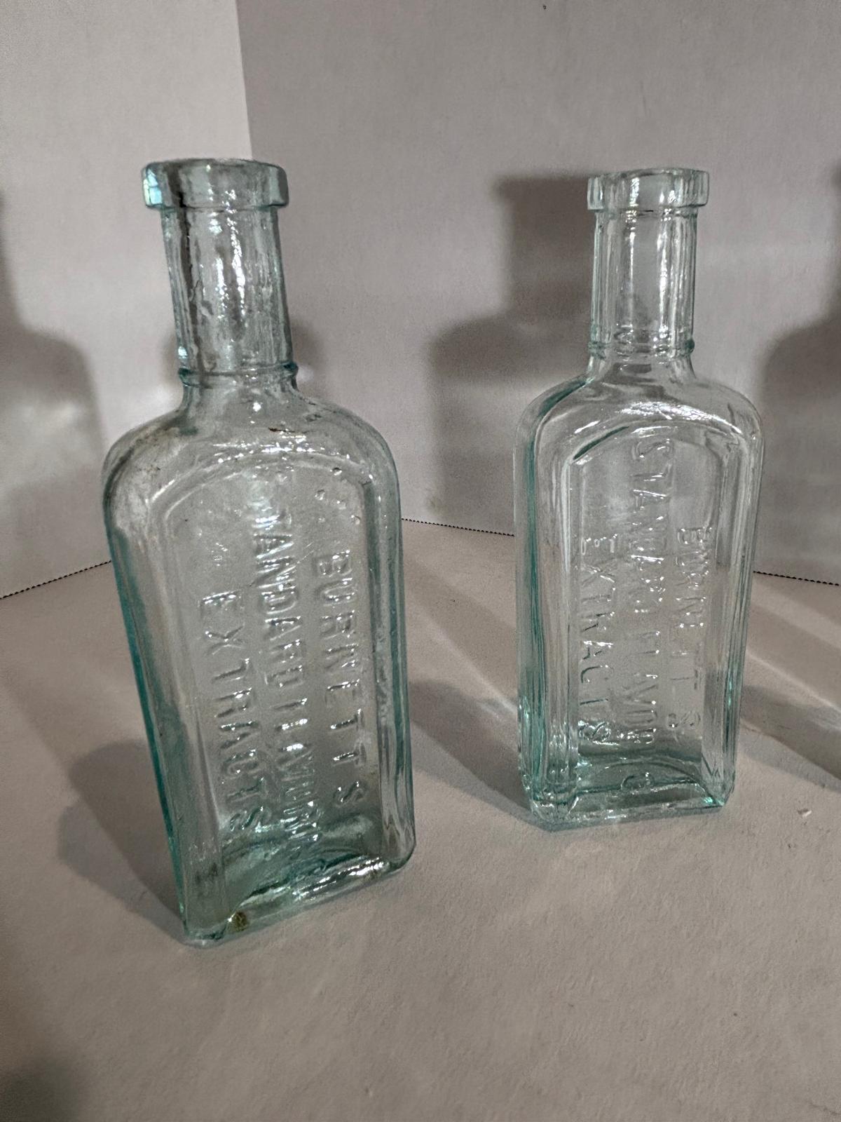 Group of Six Burnett’s Standard Flavoring Extract Bottles, Boston, Late 19th Century