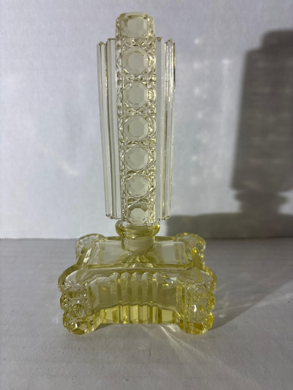 IMPORTANT ART DECO ARCHITECTURAL PERFUME BOTTLE IN URANIUM-TINTED GLASS Circa 1928–1935