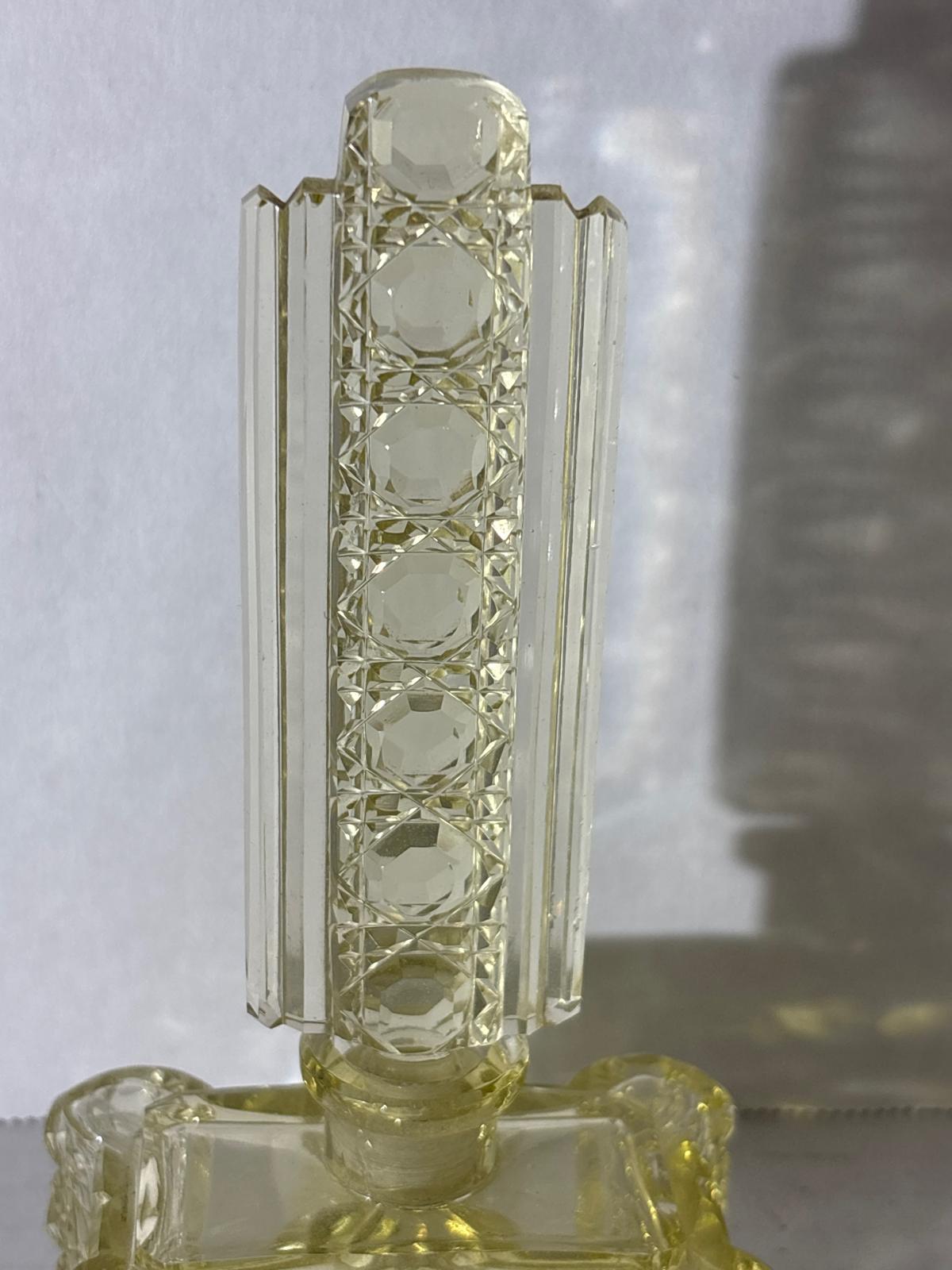 IMPORTANT ART DECO ARCHITECTURAL PERFUME BOTTLE IN URANIUM-TINTED GLASS Circa 1928–1935