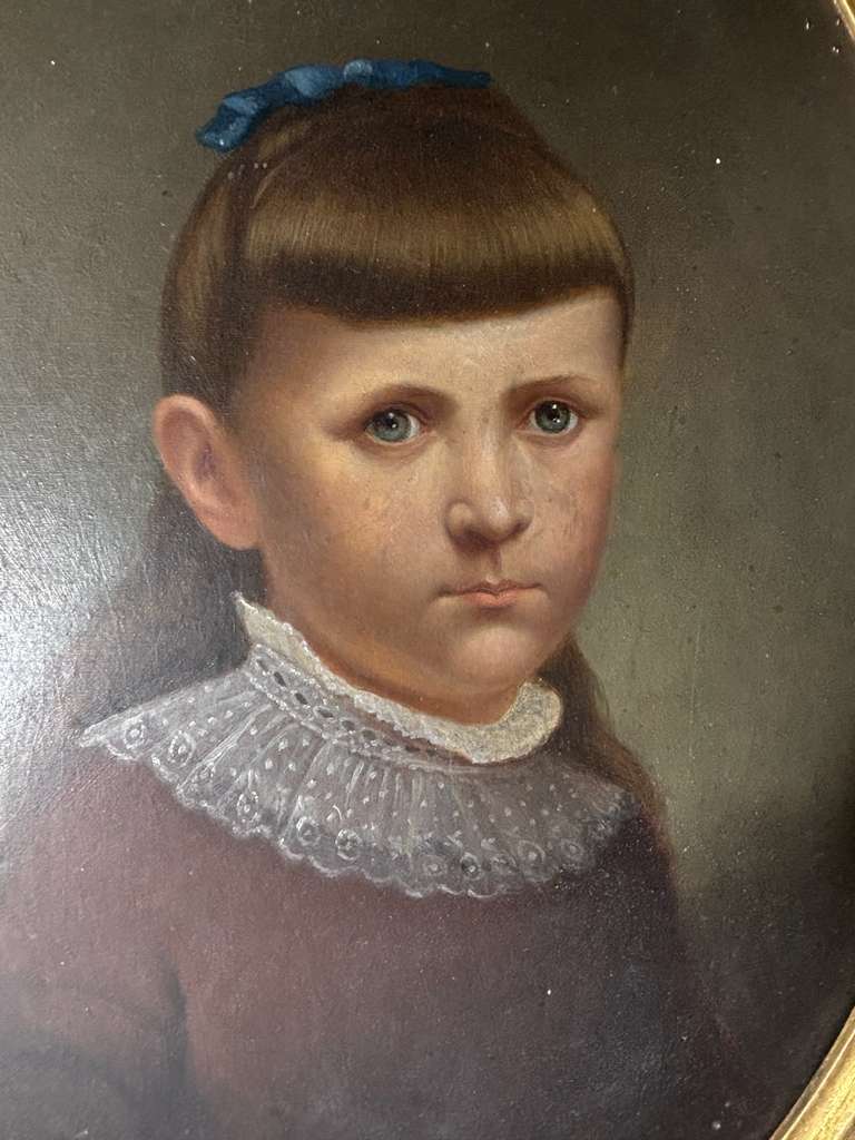 Late 19th Century American Folk Portrait of Young Girl with Blue Ribbon Oil on artist board, American, circa 1880–1895.
