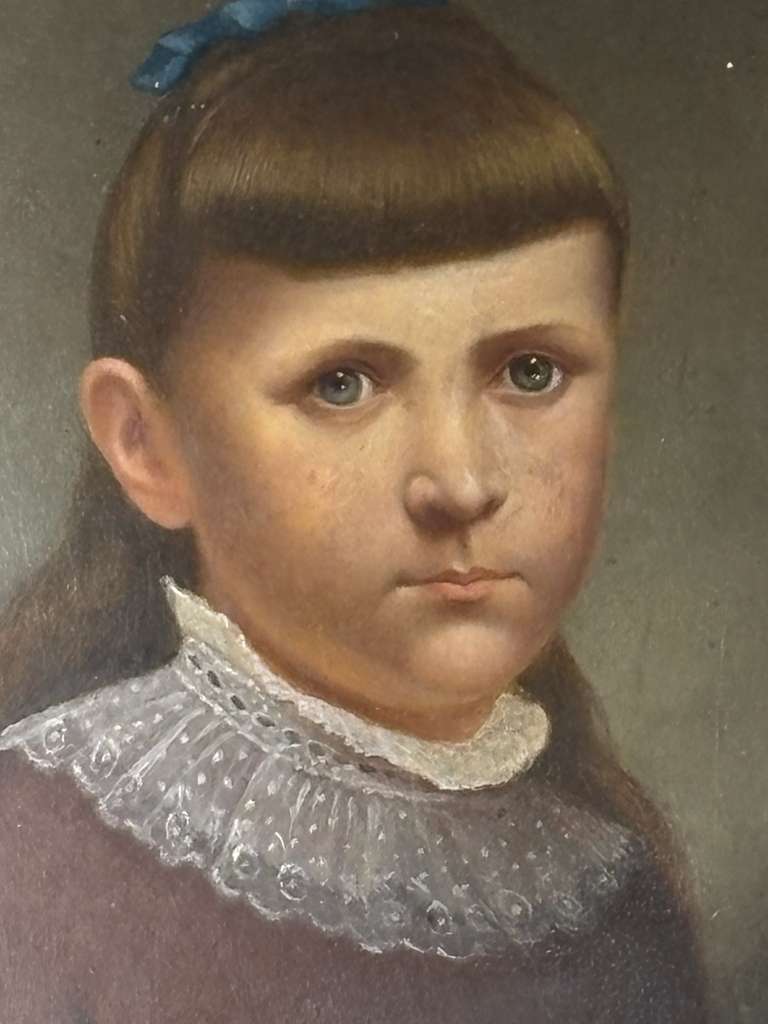 Late 19th Century American Folk Portrait of Young Girl with Blue Ribbon Oil on artist board, American, circa 1880–1895.