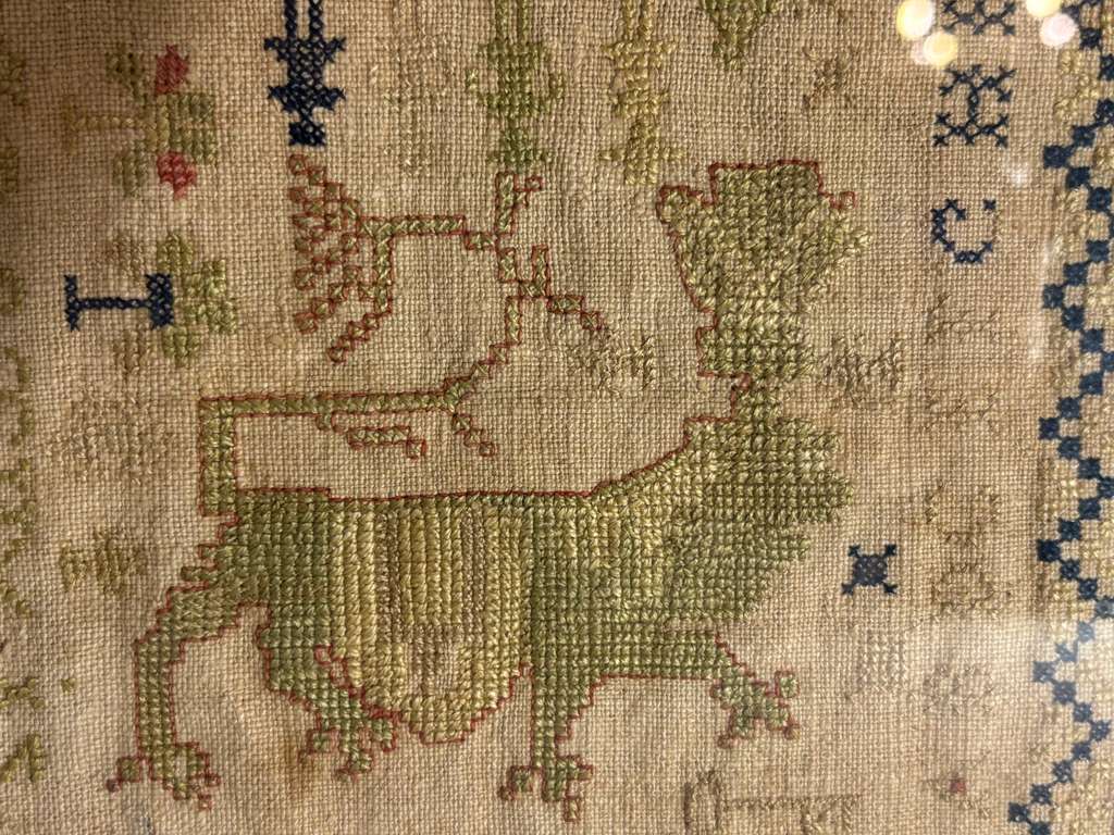 Small-Format Anglo-American Needlework Sampler with Heraldic Lion and Key Motif, likely New England, circa 1790–1810.