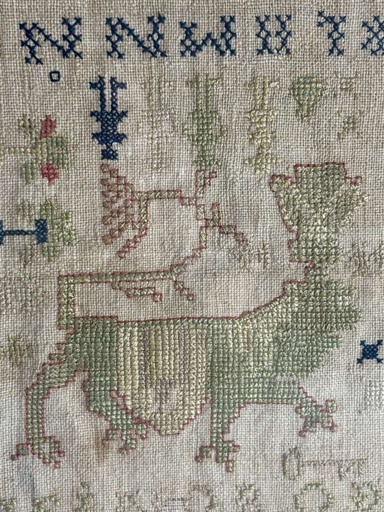 Small-Format Anglo-American Needlework Sampler with Heraldic Lion and Key Motif, likely New England, circa 1790–1810.