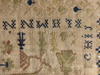 Small-Format Anglo-American Needlework Sampler with Heraldic Lion and Key Motif, likely New England, circa 1790–1810.