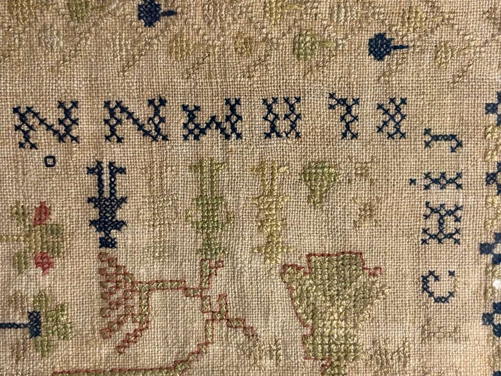 Small-Format Anglo-American Needlework Sampler with Heraldic Lion and Key Motif, likely New England, circa 1790–1810.