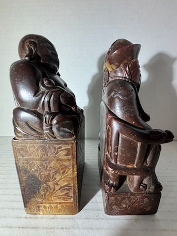 Two Chinese Carved Brown Mottled Hardstone Figural Table Carvings