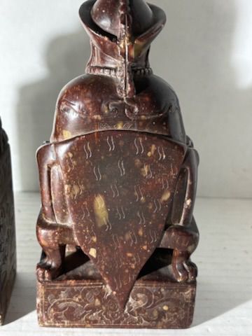Two Chinese Carved Brown Mottled Hardstone Figural Table Carvings