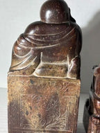 Two Chinese Carved Brown Mottled Hardstone Figural Table Carvings