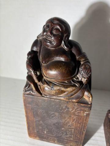Two Chinese Carved Brown Mottled Hardstone Figural Table Carvings