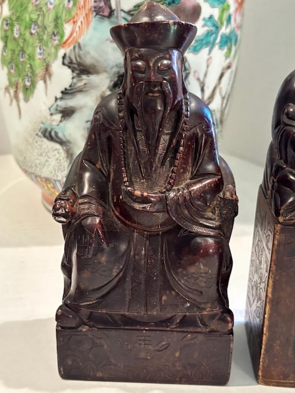 Two Chinese Carved Brown Mottled Hardstone Figural Table Carvings